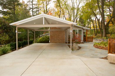 Inspiration for a small timeless beige one-story brick exterior home remodel in DC Metro