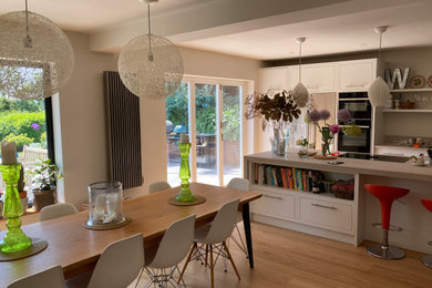 Design ideas for a dining room in Buckinghamshire with medium hardwood flooring.