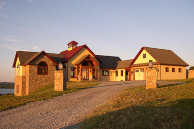 Example of a large arts and crafts beige two-story mixed siding exterior home design in Philadelphia