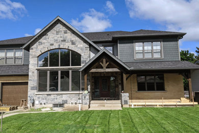 Large two-story exterior home idea in Other