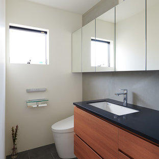 75 Beautiful Powder Room With Solid Surface Countertops And Black