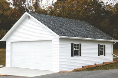 Inspiration for a mid-sized cottage detached two-car carport remodel in Salt Lake City