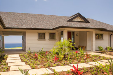 Mid-sized contemporary beige one-story mixed siding exterior home idea in Hawaii with a hip roof