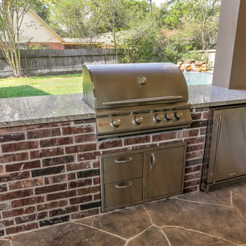 Stone Patio with Outdoor Kitchen and Pool