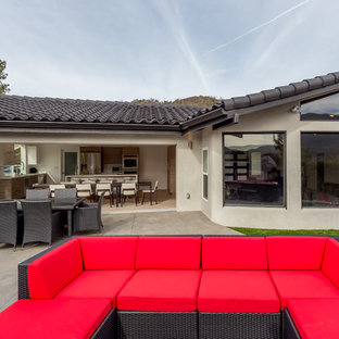 Inspiration for a modern backyard patio in Los Angeles with an outdoor kitchen, concrete slab and no cover.