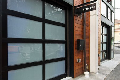 Example of a minimalist brown three-story apartment exterior design in Seattle