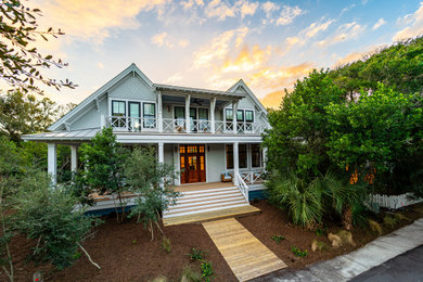 Inspiration for a coastal gray two-story house exterior remodel in Other