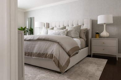 Mid-sized transitional master dark wood floor, brown floor and wallpaper bedroom photo in Toronto with blue walls and no fireplace