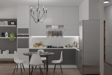 Inspiration for a large traditional u-shaped open plan kitchen in Other with an undermount sink, flat-panel cabinets, grey cabinets, marble benchtops, white splashback, porcelain splashback, black appliances, medium hardwood floors, no island, brown floor and white benchtop.