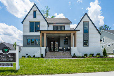 Large transitional white three-story exterior home photo in Richmond with a mixed material roof and a black roof