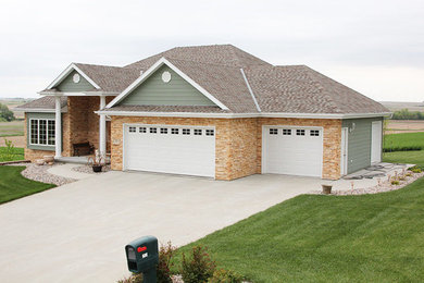 Mid-sized arts and crafts garage photo in Omaha