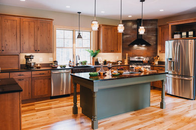 This is an example of a large transitional u-shaped eat-in kitchen in Boston.