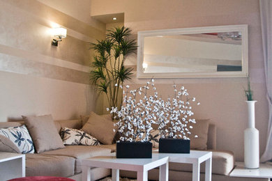 Example of a small trendy enclosed medium tone wood floor living room design in Other with beige walls
