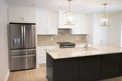Example of a mid-sized trendy single-wall slate floor, white floor and wallpaper ceiling open concept kitchen design in New Orleans with an undermount sink, flat-panel cabinets, white cabinets, marble countertops, beige backsplash, marble backsplash, stainless steel appliances, an island and beige countertops