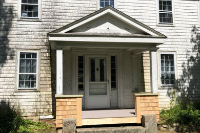 Example of a farmhouse exterior home design in Other