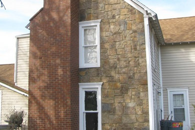 Mid-sized cottage beige two-story mixed siding house exterior photo in Kansas City with a hip roof and a shingle roof