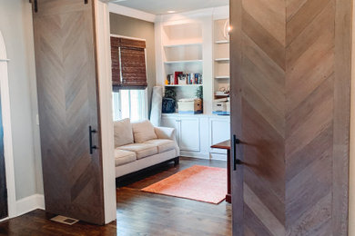 Inspiration for a large country foyer remodel in Nashville with a medium wood front door