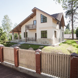 Новые идеи обустройства дома: двухэтажный фасад частного дома в стиле современная классика с крышей из гибкой черепицы