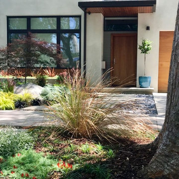 Reconfigured front entry pavers allow meandering path.