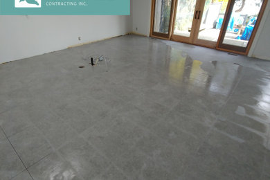 Inspiration for a mid-sized coastal porcelain tile and gray floor eat-in kitchen remodel in Other