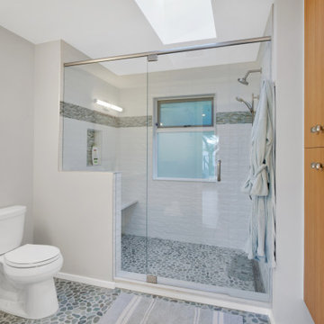 Primary Bathroom with Pebble Floor, Tiled Shower & Custom Oak Vanity