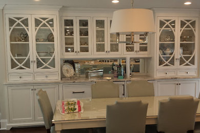 Enclosed dining room - large modern dark wood floor enclosed dining room idea in New York with gray walls