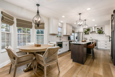 Large transitional u-shaped eat-in kitchen photo in Philadelphia with quartz countertops and an island