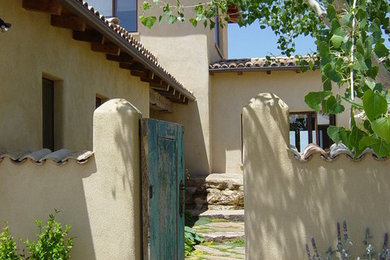 Inspiration for a southwestern entryway remodel in Other with beige walls