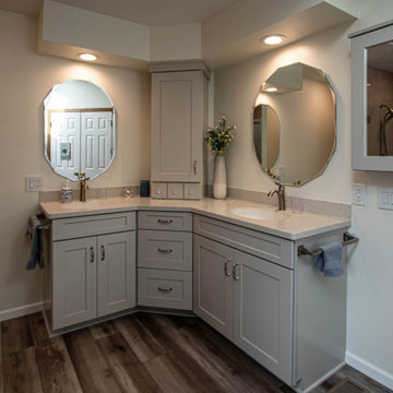 Waypoint Gray Shaker Door Cabinetry with Tiled Shower and Matching Tub Surround