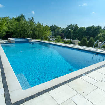 Burr Ridge Lap Pool with Raised Hot Tub and Waterfall