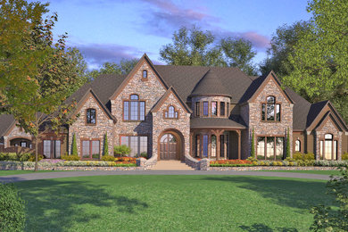 Design ideas for a large traditional two-storey exterior in Dallas with stone veneer.