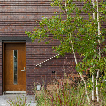Lac La Belle - Modern Brick Lake Home with Dock and Boathouse