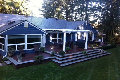 Deck - traditional backyard deck idea in Seattle with a pergola