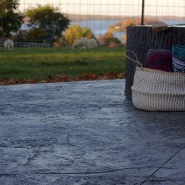 Stamped concrete pad with concrete fire pit