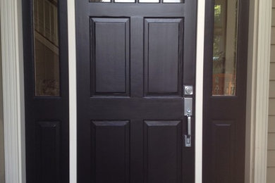 Entryway - mid-sized traditional entryway idea in Seattle with a dark wood front door