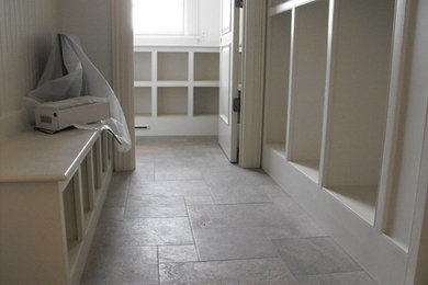 Example of a mid-sized transitional ceramic tile hallway design in Boston with beige walls