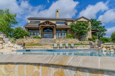 Example of a huge mountain style three-story mixed siding exterior home design in Austin