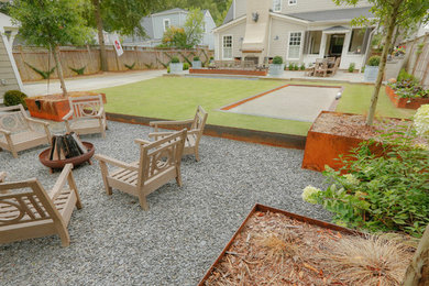 Photo of a mid-sized contemporary backyard outdoor sport court in Atlanta with natural stone pavers.