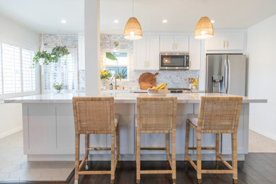 Mid-sized farmhouse eat-in kitchen photo in Los Angeles with shaker cabinets and an island