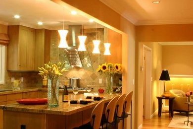 Example of a mid-sized trendy l-shaped medium tone wood floor and brown floor kitchen design in San Francisco with an undermount sink, shaker cabinets, light wood cabinets, granite countertops, beige backsplash, ceramic backsplash, stainless steel appliances and an island