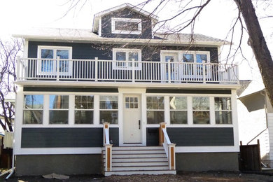 Inspiration for a mid-sized coastal blue two-story wood exterior home remodel in Other with a shingle roof