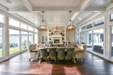 Large transitional open plan dining in Tampa with beige walls, dark hardwood floors, a standard fireplace, a stone fireplace surround and brown floor.