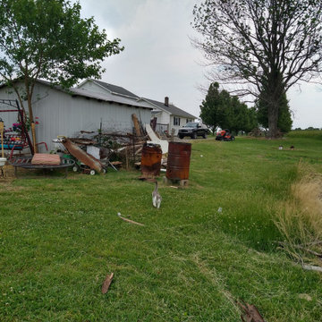 Small raised enclosed garden and patio area