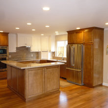 kitchen pantry cabinet next to refrigerator