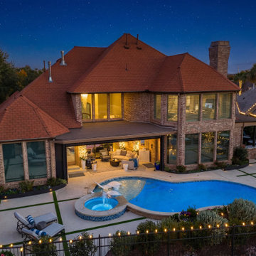 Custom Outdoor Living Pool Deck with Stamped Concrete & Turf