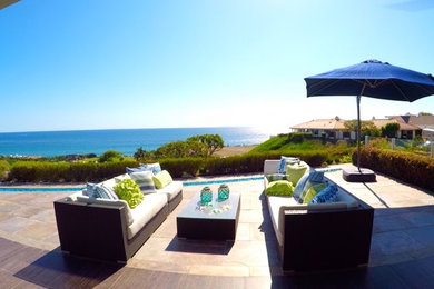 Inspiration for a large backyard patio remodel in Orange County with no cover