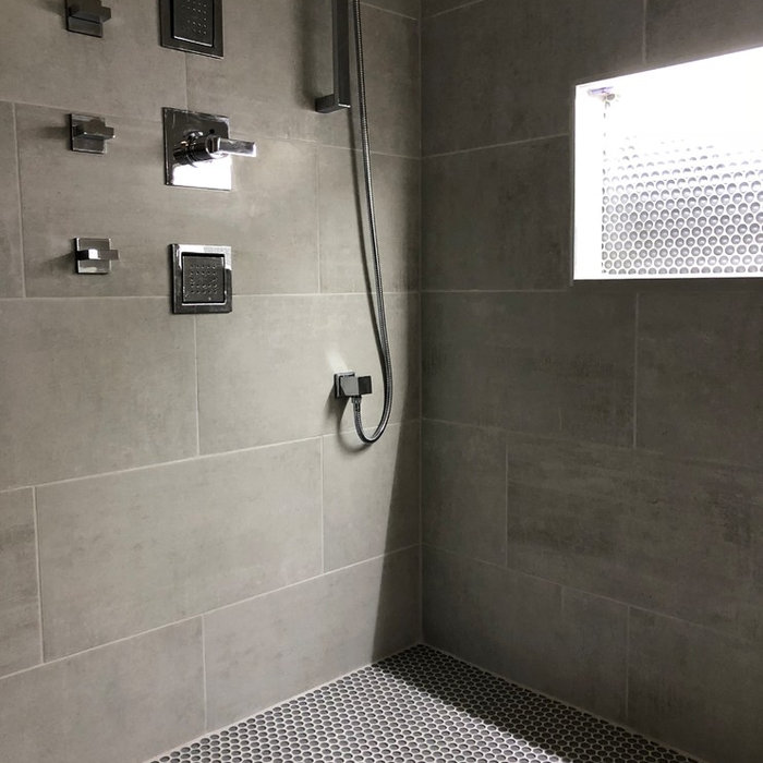 Bathroom - large modern master gray tile and cement tile ceramic tile and gray floor bathroom idea in Detroit with flat-panel cabinets, dark wood cabinets, gray walls, an undermount sink, quartz count