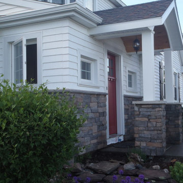 Addition with door canopy and stone work