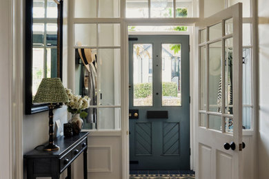 Inspiration for a large classic vestibule in Other with grey walls, ceramic flooring, a single front door, a blue front door, multi-coloured floors and panelled walls.