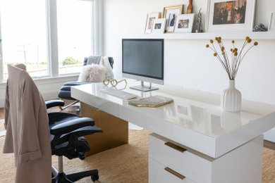 Study room - mid-sized scandinavian freestanding desk brown floor, wallpaper, vaulted ceiling and medium tone wood floor study room idea in Edinburgh with white walls